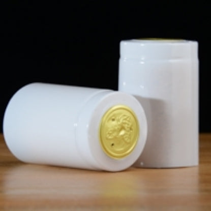 White and gold wine capsule