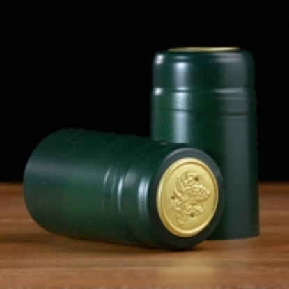 Green and gold wine capsule